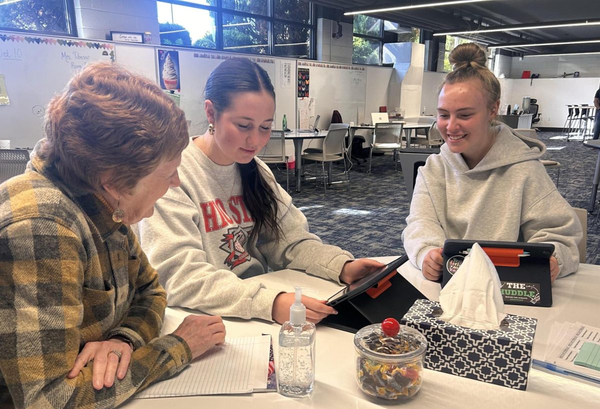 Math tutor Cathy Bakes helps Seniors Gemma Alexander and Jess Krejsa prepare for a math test. 
PHOTO COURTESY OF HEIDI MALTEMPI